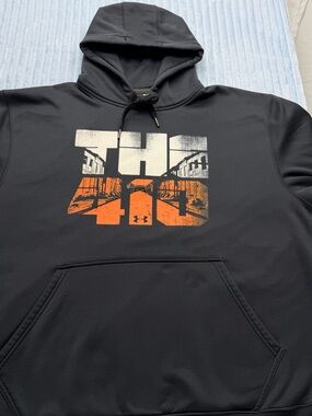 Under Armour Black Hoodie with White and Orange Chest Graphic
